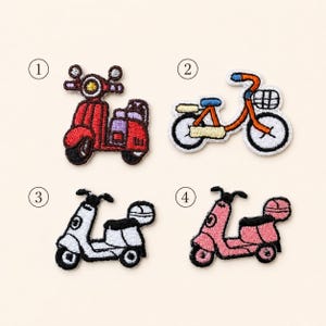 May include: Four embroidered patches featuring transportation themes: a red scooter labeled 1, an orange bicycle with a basket labeled 2, a white scooter labeled 3, and a pink scooter labeled 4. Each patch has detailed stitching and black outlines.