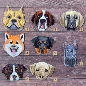 May include: A collection of eight embroidered dog face patches. The patches feature various breeds, including a Shiba Inu, Rottweiler, and a Bulldog. Each patch is intricately detailed with realistic features and colors, perfect for adding to clothing or accessories.