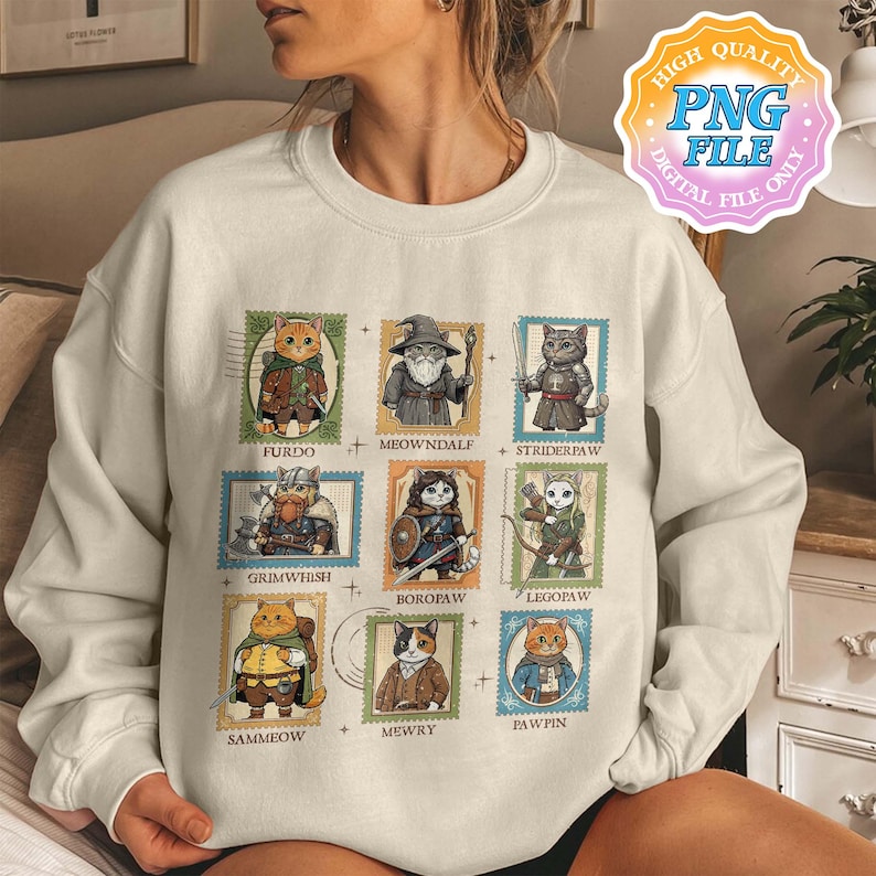 Op de afbeelding: Cr&egrave;mekleurige sweatshirt met kattenillustraties in postzegelontwerpen. Elke postzegel toont een ander kattenpersonage met namen als "Furdo" en "Meowndale". Het ontwerp bevat de tekst "HIGH QUALITY PNG FILE DIGITAL FILE ONLY."