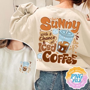 May include: A beige sweatshirt with a graphic design of a glass of iced coffee and the text "Sunny with a chance of Iced Coffee". The graphic is in brown, orange, and blue. The sweatshirt has a high quality PNG file label.