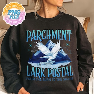 May include: Black sweatshirt with a blue and white graphic. The graphic features the words "PARCHMENT LARK POSTAL" with a geometric bird, mountains, and the text "FROM THE BURN TO THE SHADE". A digital file logo is in the upper left corner.