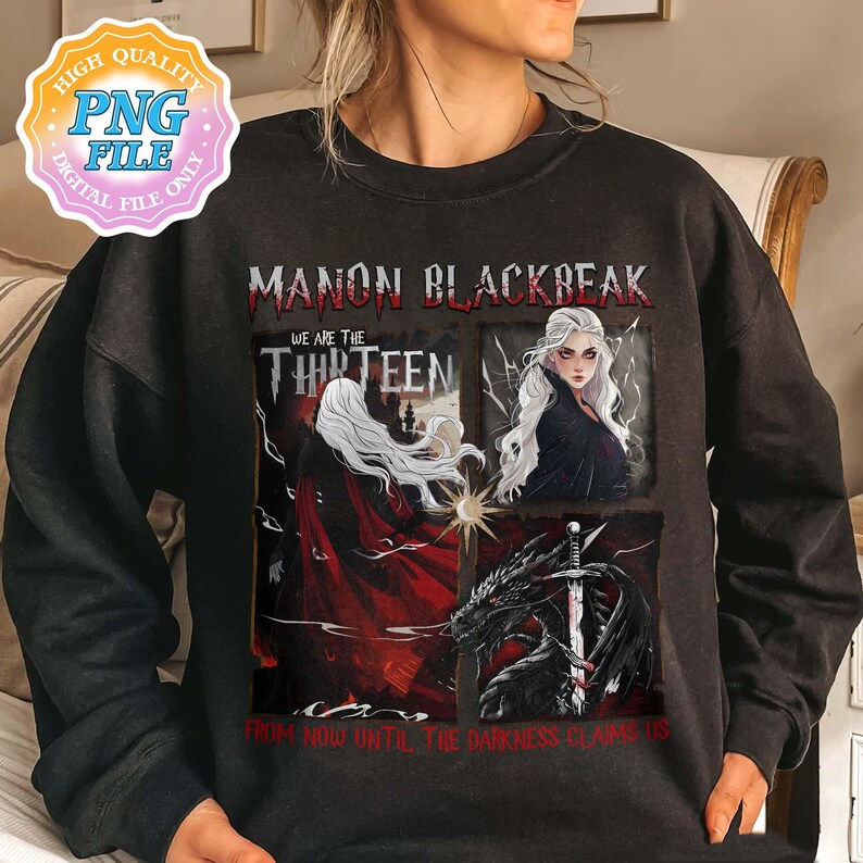 May include: Black sweatshirt with a graphic print of a woman with white hair and a red cape, a dragon, and the text "Manon Blackbeak We are the Thirteen From now until the darkness claims us".
