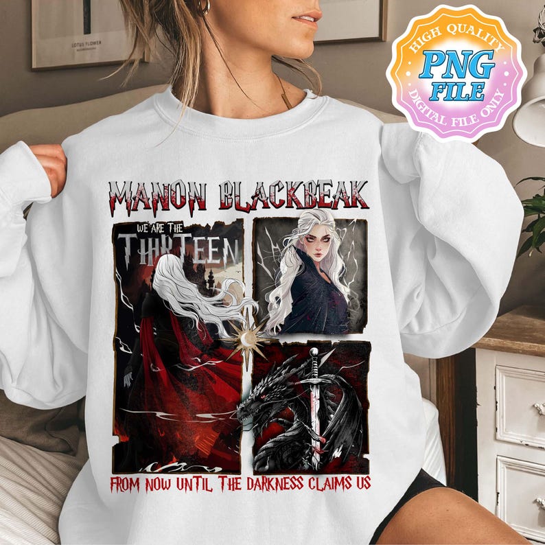 May include: A white sweatshirt with a graphic print of a woman with long white hair and the text "Manon Blackbeak We Are The Thirteen From Now Until The Darkness Claims Us".