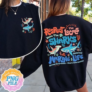 May include: Black sweatshirt with a graphic design featuring a shark and the text "Respect the Locals Save the Sharks Marine Life Spread Awareness - Share Information".