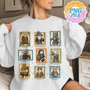 Op de afbeelding: Witte sweatshirt met negen kattenillustraties in de stijl van postzegels. Elke kat is afgebeeld in fantasy-kleding, met namen als "Furdo" en "Meowndalf" eronder. Het ontwerp bevat een "High Quality PNG File" grafiek.