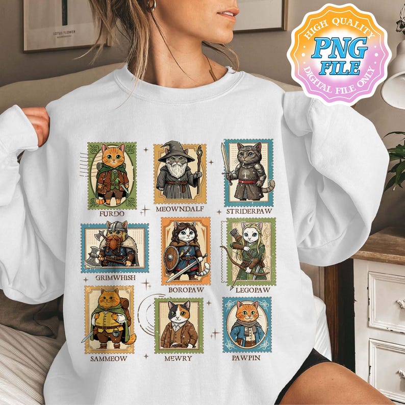 Op de afbeelding: Witte sweatshirt met negen kattenillustraties in de stijl van postzegels. Elke kat is afgebeeld in fantasy-kleding, met namen als "Furdo" en "Meowndalf" eronder. Het ontwerp bevat een "High Quality PNG File" grafiek.