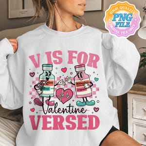 May include: White sweatshirt with a pink graphic that reads "V IS FOR Valentine VERSED." The graphic features two cartoon medicine bottles holding hands, a heart, and other Valentine's Day themed elements. The words "HIGH QUALITY PNG FILE DIGITAL FILE ONLY" are in the top right corner.