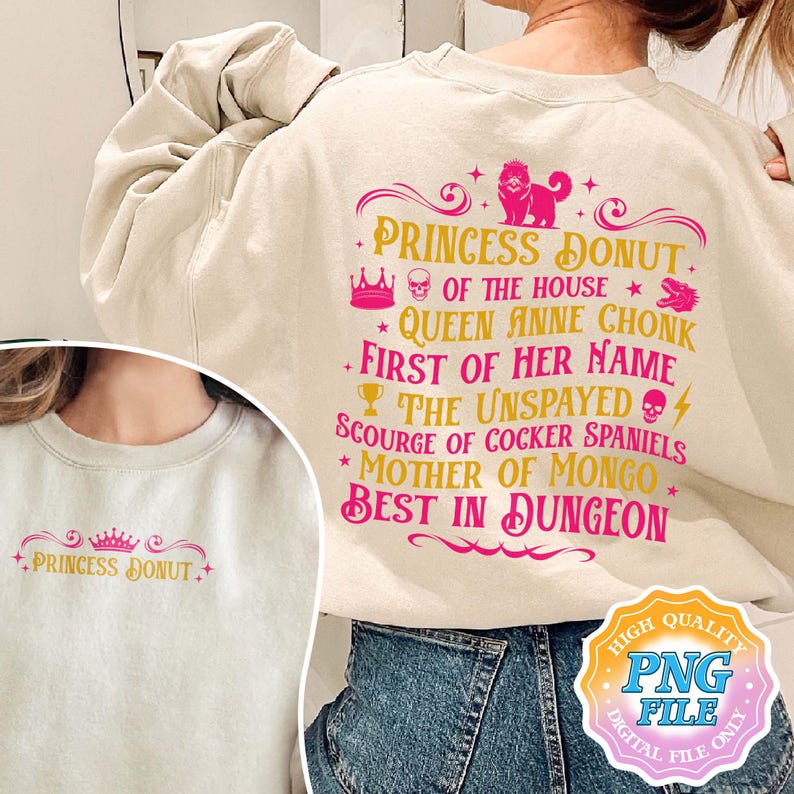 May include: Cream-colored sweatshirt with pink and gold text that reads "Princess Donut" and a list of humorous titles. The design includes a crown, a lion, and other decorative elements. A smaller version of the design is on the front.