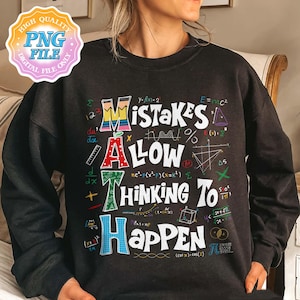 May include: Black sweatshirt with a colorful graphic print that says "Mistakes Allow Thinking To Happen" surrounded by mathematical symbols and equations.