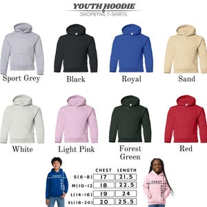 a collection of youth hoodie designs in various colors and styles, including sport grey, black, royal, sand, white, light pink, forest green, red, and pink. The hoodies are arranged in a grid format, with each row representing a different color and each column representing a different style. The image also includes a young girl wearing a pink hoodie, providing a visual representation of the available sizes and styles.