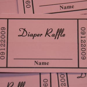 May include: Pink raffle ticket with the text "Diaper Raffle" and spaces for a name and a number. The ticket number is 09122009.