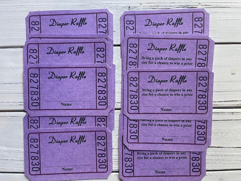 May include: Purple diaper raffle tickets with the text "Diaper Raffle" and "Bring a pack of diapers in any size for a chance to win a prize". The tickets have a space for a name and the numbers 827830.