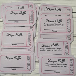 May include: A stack of pink and white raffle tickets with the text "Diaper Raffle" and "Bring a pack of diapers in any size for a chance to win a prize."  The tickets have a blank space for a name.