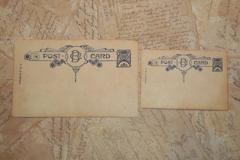 May include: Two vintage postcards with a beige background. The postcards have a decorative blue design with the words "POST-CARD" and a central "B" initial. The postcards are on a background of old paper.