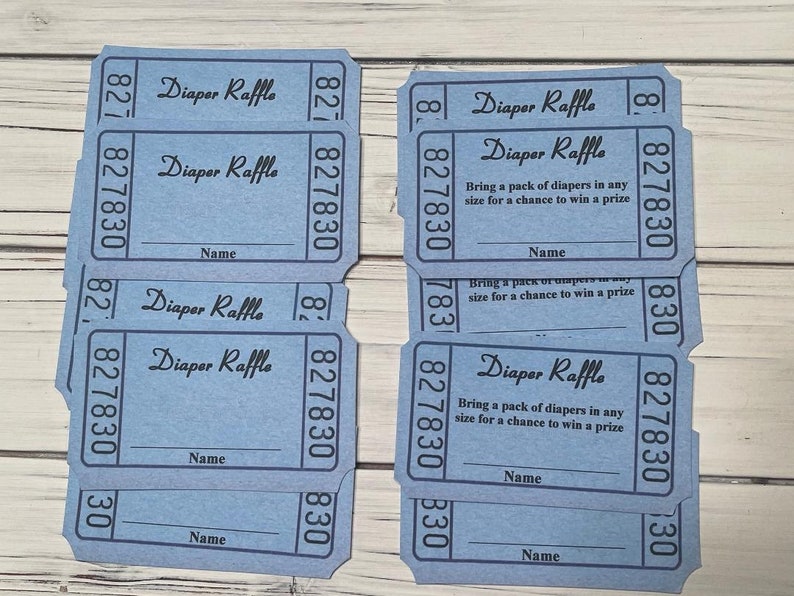 May include: Eight blue raffle tickets with the text "Diaper Raffle" and instructions to bring a pack of diapers for a chance to win a prize. Each ticket has a space for a name and the number 827830.