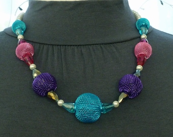 Necklace of aqua, purple and pink mesh balls with iridescent teardrop crystals and white pearls 24"