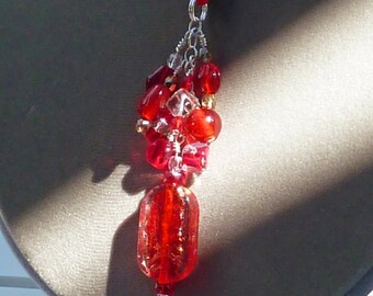 Pendant necklace with red/clear/gold foil glass rectangle hanging from red Czech glass and seed beads on SS chain