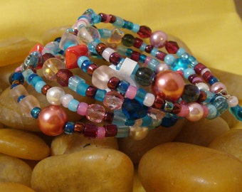 Bracelet, aqua red pink, glass and seed beads, regular, memory wire