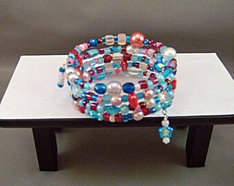 Bracelet, aqua red pink, glass and seed beads, regular, memory wire