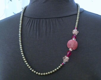 Silver pearl necklace with a pink mesh ball surrounded by pink and crystal bead accents 29"