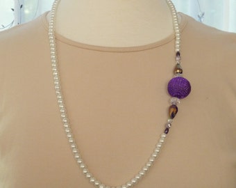 White pearl necklace with a purple mesh ball, crystal and purple bead accents 29"