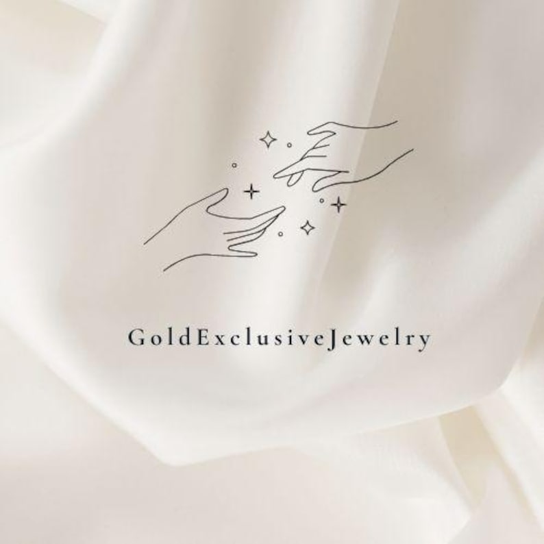 May include: A minimalist line drawing of two hands reaching towards each other with stars and dots in between. The text "GoldExclusiveJewelry" is below the drawing.