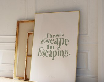May include: A white poster with a gold frame, hanging on a white wall, with the text "There's Escape in Escaping." in green lettering.