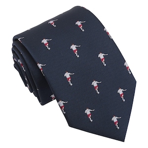 May include: Navy blue tie with a repeating pattern of soccer players in white and red. The tie is folded and has a textured appearance, suitable for formal or semi-formal occasions.
