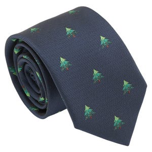May include: A rolled navy blue tie featuring a repeating pattern of green Christmas trees with red trunks. The tie's fabric has a textured appearance. A classic accessory for formal or festive occasions.