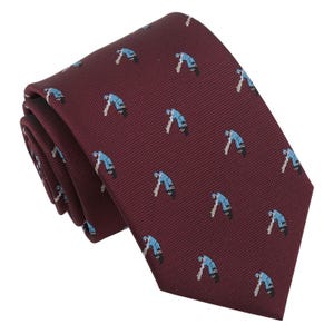 May include: A maroon necktie with a repeating pattern of blue cricket players.
