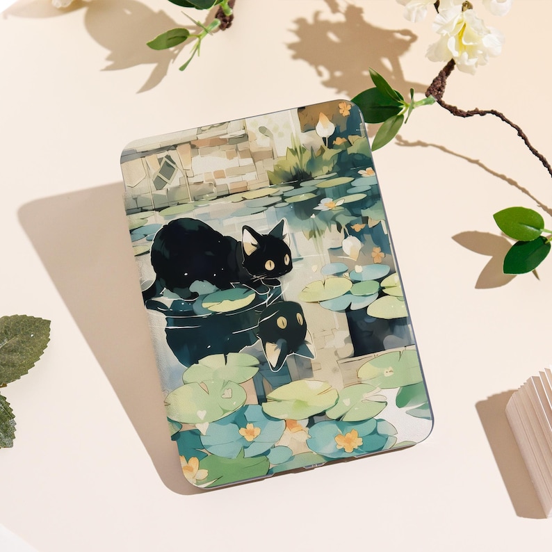 May include: A rectangular case featuring a whimsical illustration of a black cat on lily pads in a pond. The artwork has a watercolor style with soft blues, greens, and yellows. The case has a glossy finish and a rounded edge.