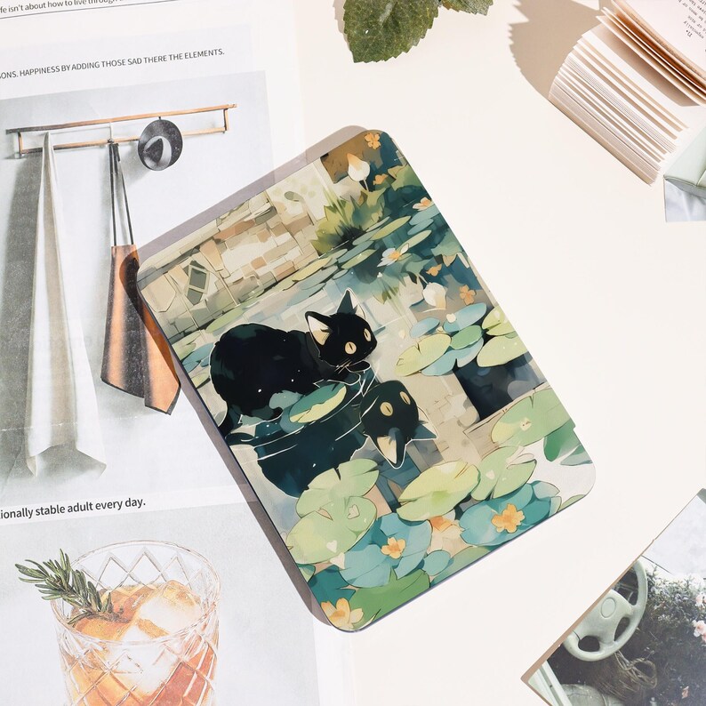 May include: Rectangular decorative panel featuring a black cat and a duck in a pond with lily pads. The artwork has a watercolor style with soft greens, blues, and yellows. The panel is on a white surface.