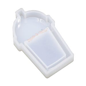 May include: A clear, white silicone mold in the shape of a beverage cup. The mold has a rectangular inner section and the text "Sophie & Toffee" is visible. Ideal for crafting resin art or DIY projects.