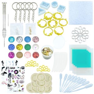 May include: A craft kit with various supplies for resin art. Includes keychains, molds, glitter, gold-colored mermaid and starfish charms, seashells, stickers, and pipettes. The kit also contains a drill and other tools.