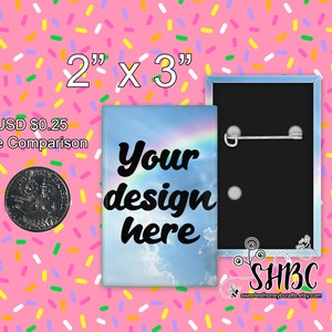 May include: A 2 inch by 3 inch button with a rainbow and clouds design. The text "Your design here" is printed in black on the button. The back of the button is black with a pin.