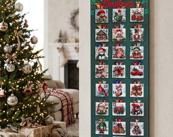 May include: A tall, rectangular dark green wooden advent calendar featuring the text Merry Christmas at the top. It has twenty-four small square pockets, each numbered one through twenty-four, decorated with various festive holiday illustrations.