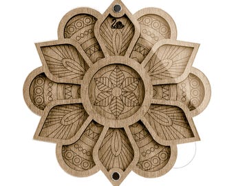 May include: A light brown wooden tray shaped like a flower with multiple petals. The center features a six-leaf design, while the surrounding petals display intricate geometric patterns including circles and lines. Two small dark magnets are visible.