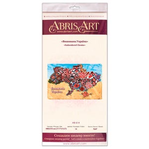 May include: A packaged bead embroidery kit featuring a map of Ukraine in traditional embroidered patterns. The kit includes the text "Embroidered Ukraine" and the Abris Art logo. The package dimensions are 17.7 x 12.2 inches.