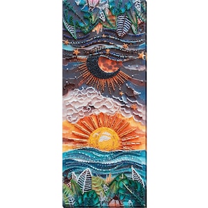May include: A beaded artwork depicting a landscape with a sunrise over the ocean and a crescent moon in the night sky. The artwork features detailed beadwork in shades of orange, blue, green, and white, creating a textured and vibrant scene.