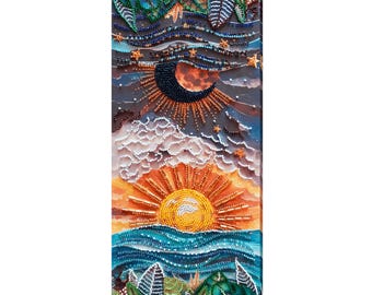 May include: A beaded artwork depicting a landscape with a sunrise over the ocean and a crescent moon in the night sky. The artwork features detailed beadwork in shades of orange, blue, green, and white, creating a textured and vibrant scene.