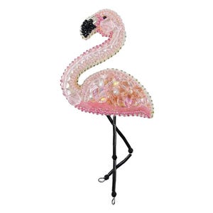 May include: A pink flamingo ornament made of beads and sequins. The flamingo is standing on one leg with its head turned to the side. The ornament is perfect for adding a touch of whimsy to any home decor.