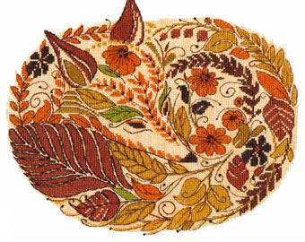 May include: A cross-stitch pattern featuring a fox surrounded by autumn leaves and flowers in shades of orange, brown, and yellow.