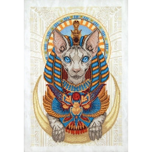 May include: A white hairless cat wearing a gold and blue Egyptian pharaoh headdress with a crescent moon behind it.