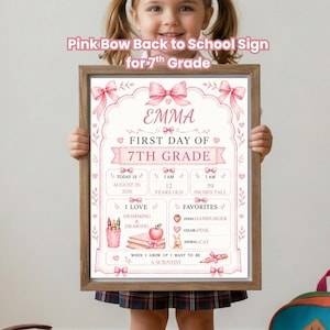 May include: A framed sign with a pink bow theme for the first day of 7th grade. The text includes the name Emma, the date August 20, 2026, age 12, and height 59 inches. It lists favorites like hamburger, pink, and cat, plus hobbies and career goals.