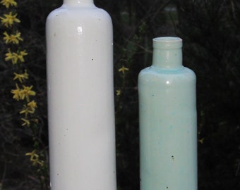 2 antique stoneware pottery James Beam tall sand white bottle and light blue liquor Jim Beam bottles