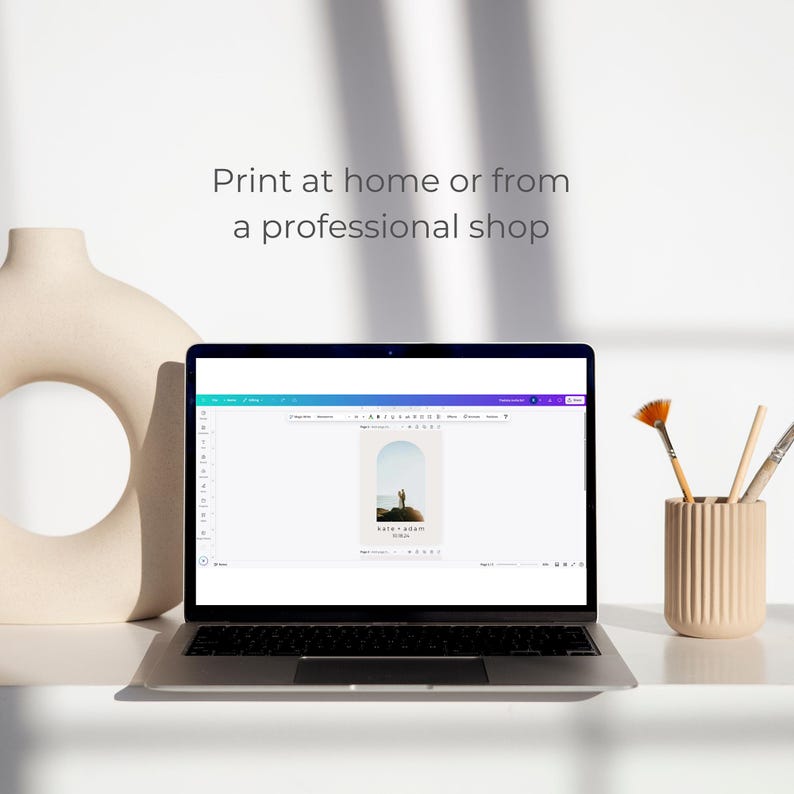 May include: A laptop computer displaying a website with a design template for a wedding invitation. The template features a photo of a couple standing on a beach with a sunset in the background. The text on the template reads "Kate & John" and "October 2020".