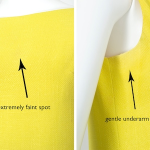 May include: A bright yellow sleeveless dress with a slight fade under the arms and an extremely faint spot on the front.