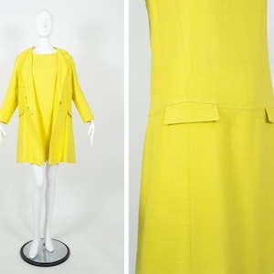 May include: A bright yellow dress and matching coat set. The dress has a simple, straight silhouette and the coat has a classic collar and long sleeves.