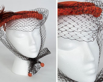 Vintage orange velvet veiled cocktail hat, 1950s saucer bonnet, feathers and ball fringe