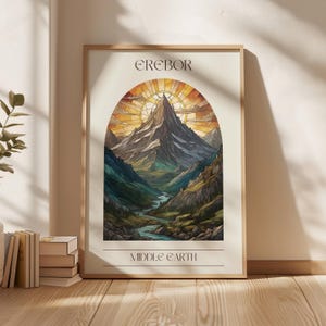 May include: A stained glass style illustration of a mountain range with a river flowing through it. The image is framed in a white frame with the text "EREBOR" at the top and "MIDDLE EARTH" at the bottom.